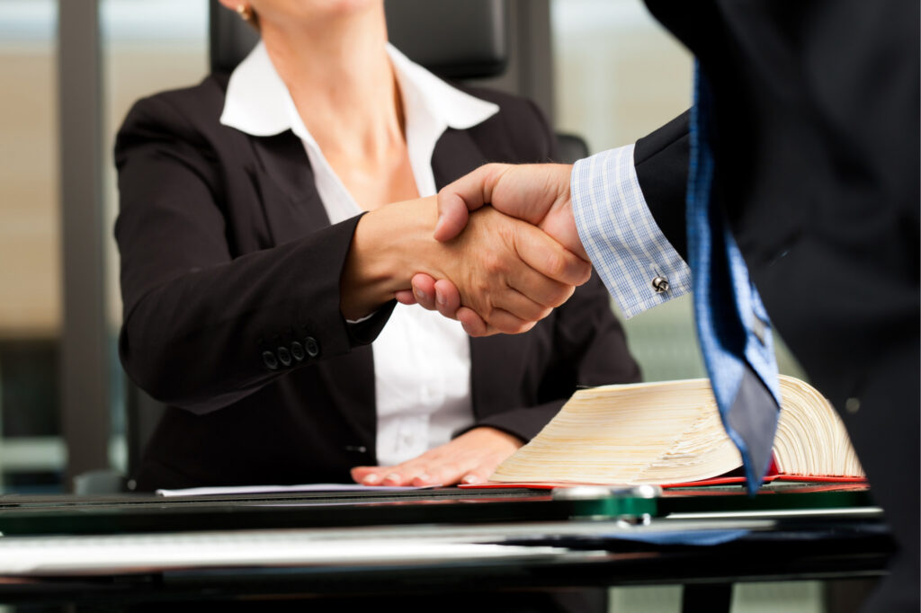 Solicitors shaking hands in Barnet close up shot